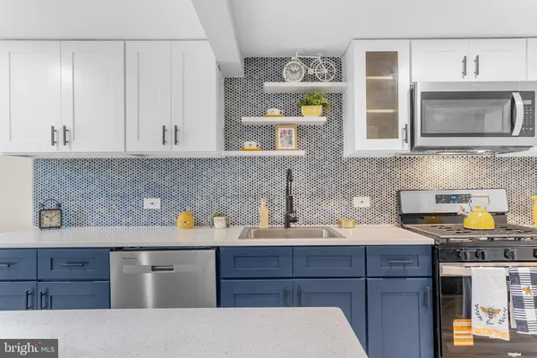 a kitchen with a sink and cabinets