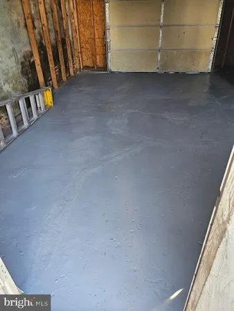 a view of an empty room and stairs