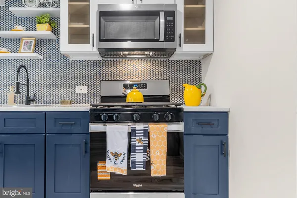 a kitchen with a stove and a microwave