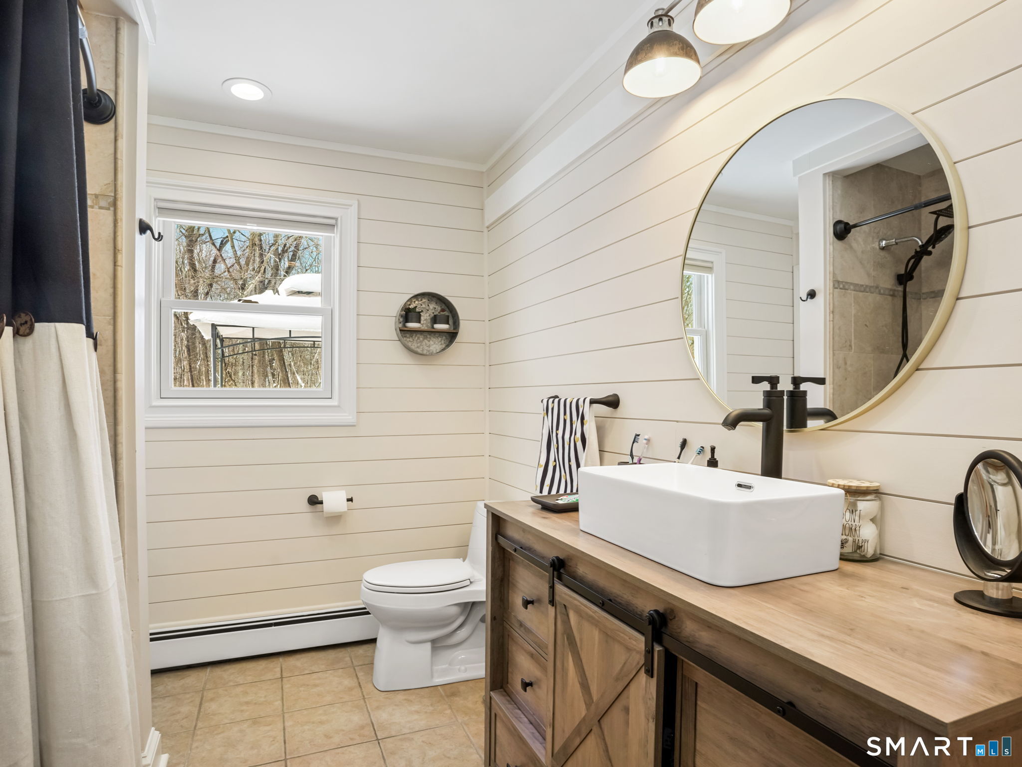 16 Deepdene Road Trumbull, CT 06611 - Photo 13 of 25 a bathroom with a sink a toilet and shower