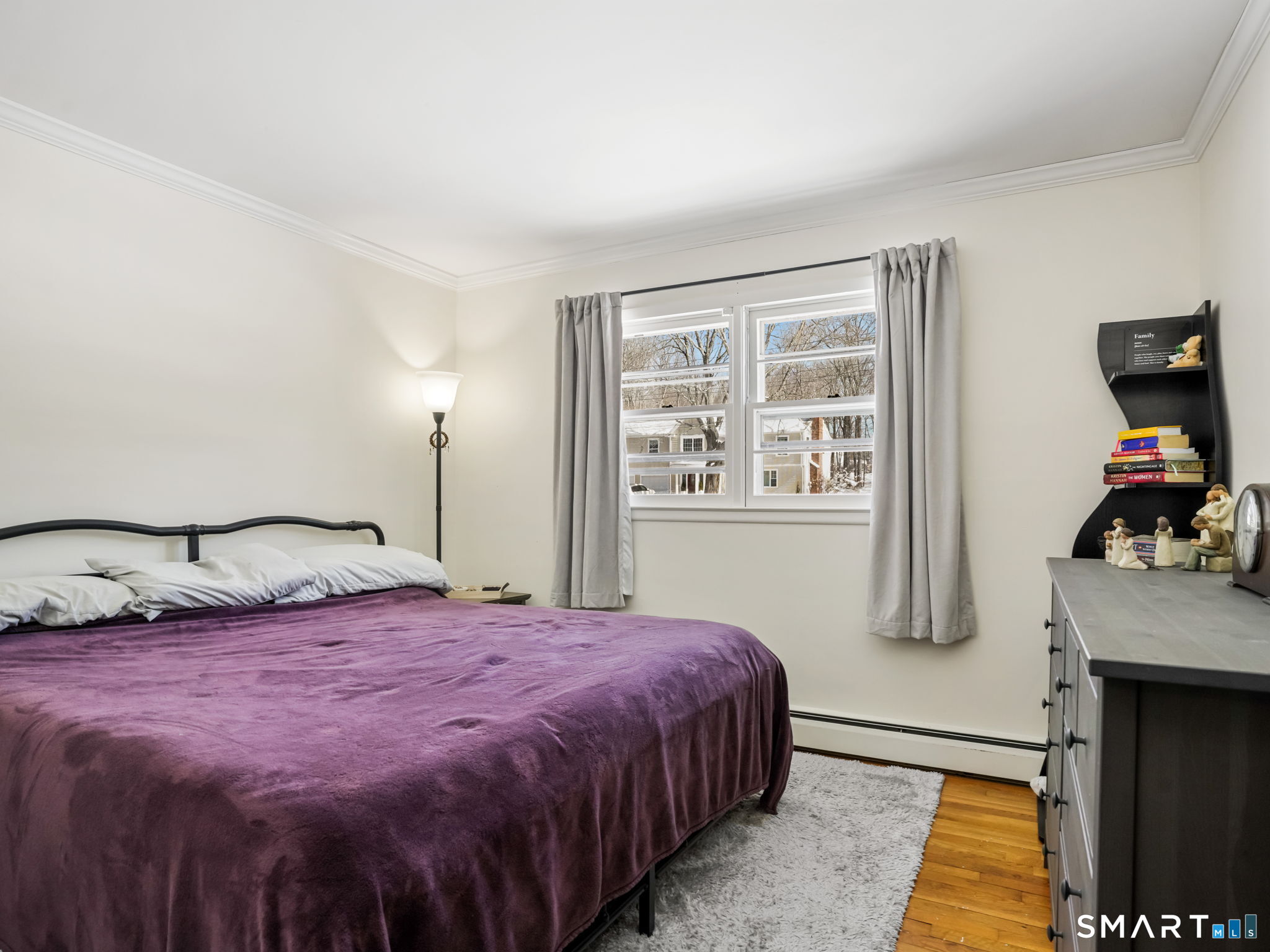 16 Deepdene Road Trumbull, CT 06611 - Photo 14 of 25 a bedroom with a bed and a flat tv screen on a dresser