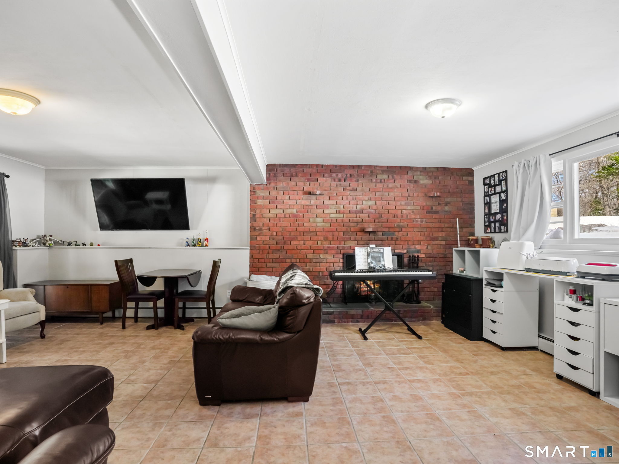 16 Deepdene Road Trumbull, CT 06611 - Photo 19 of 25 a living room with furniture window and a flat screen tv