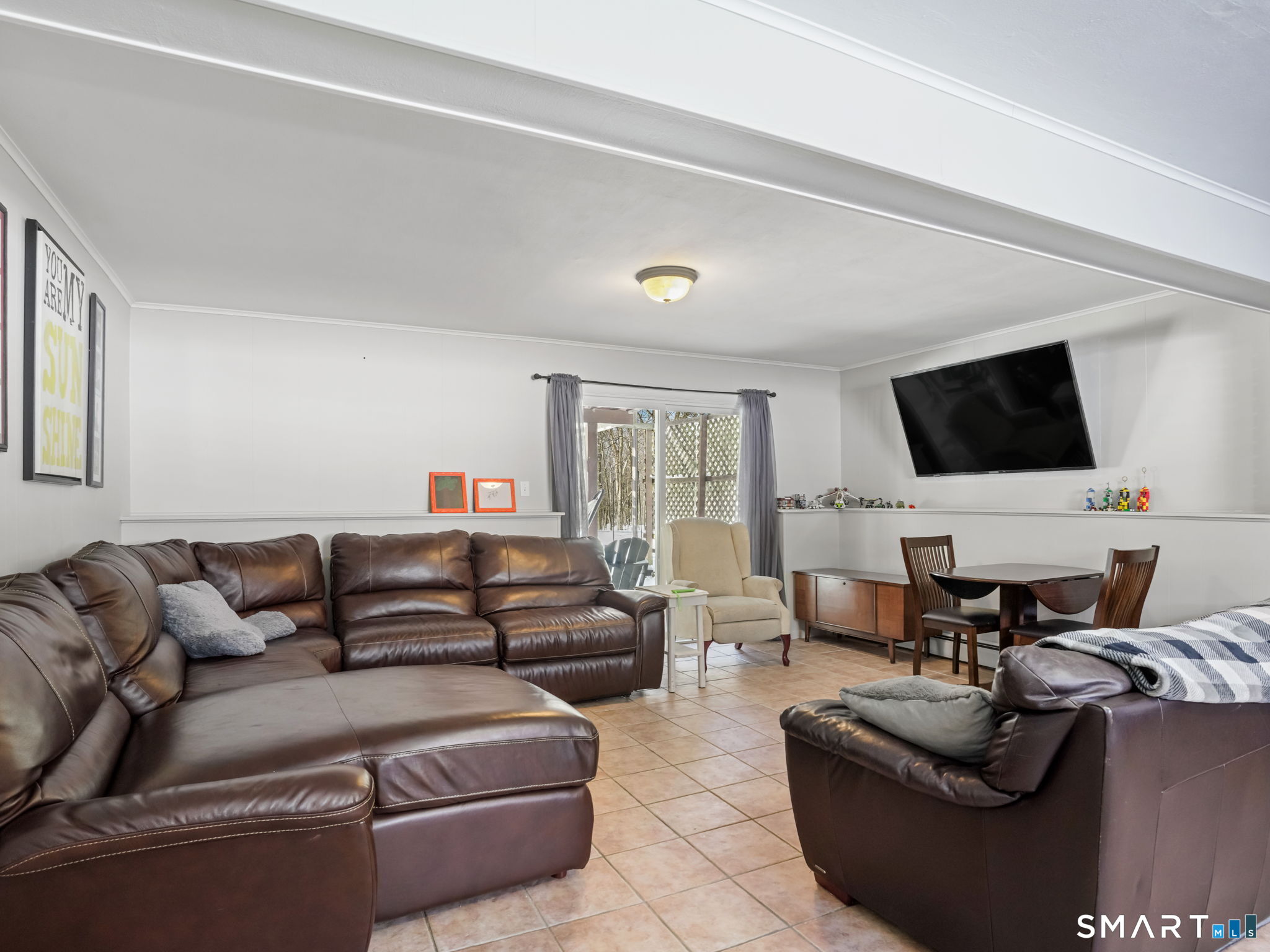 16 Deepdene Road Trumbull, CT 06611 - Photo 20 of 25 a living room with furniture and a flat screen tv