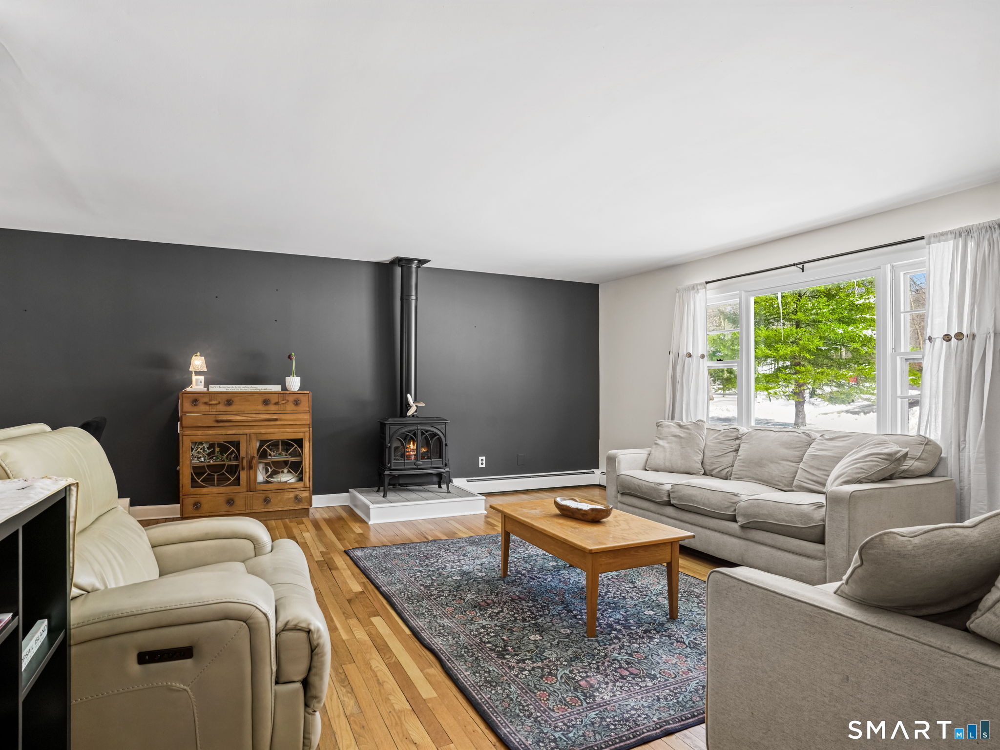 16 Deepdene Road Trumbull, CT 06611 - Photo 2 of 25 a living room with furniture a rug and a large window
