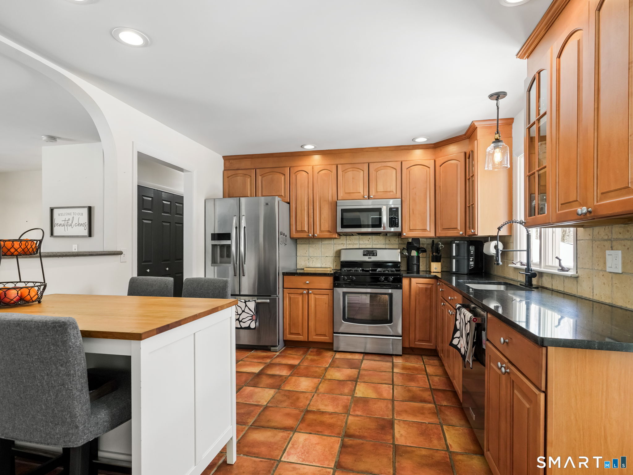 16 Deepdene Road Trumbull, CT 06611 - Photo 8 of 25 a kitchen with stainless steel appliances granite countertop a refrigerator stove microwave and sink