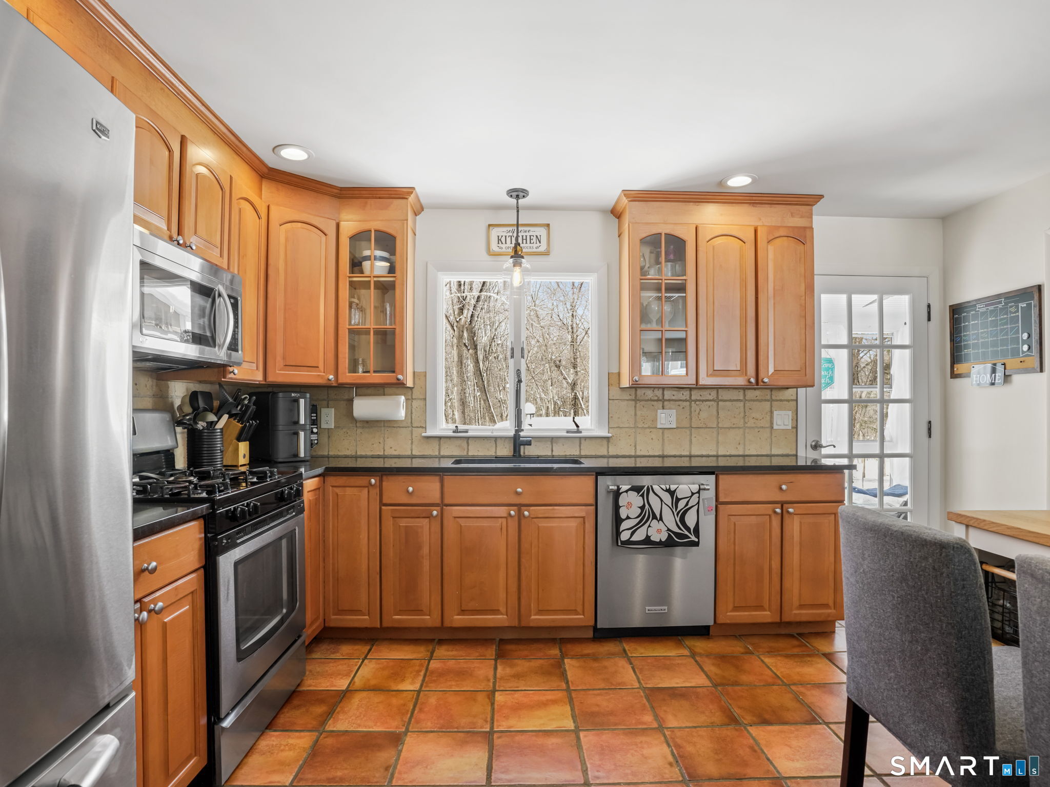 16 Deepdene Road Trumbull, CT 06611 - Photo 9 of 25 a kitchen with stainless steel appliances granite countertop a stove a sink and a refrigerator