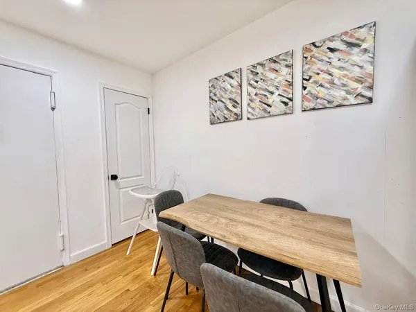 a dining room with a table and chairs