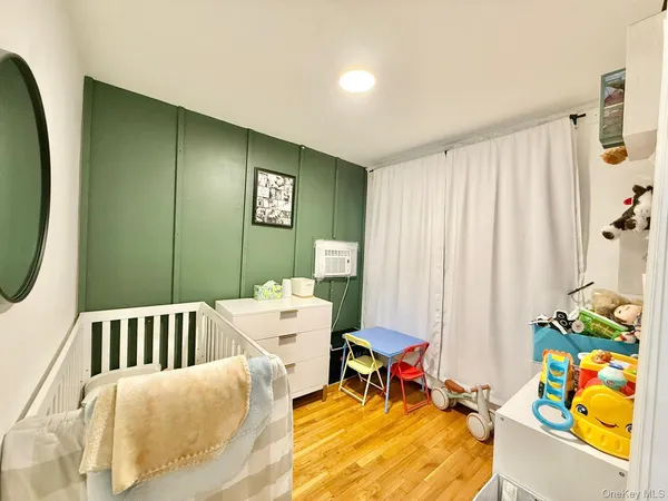 a bedroom with furniture and a bathtub