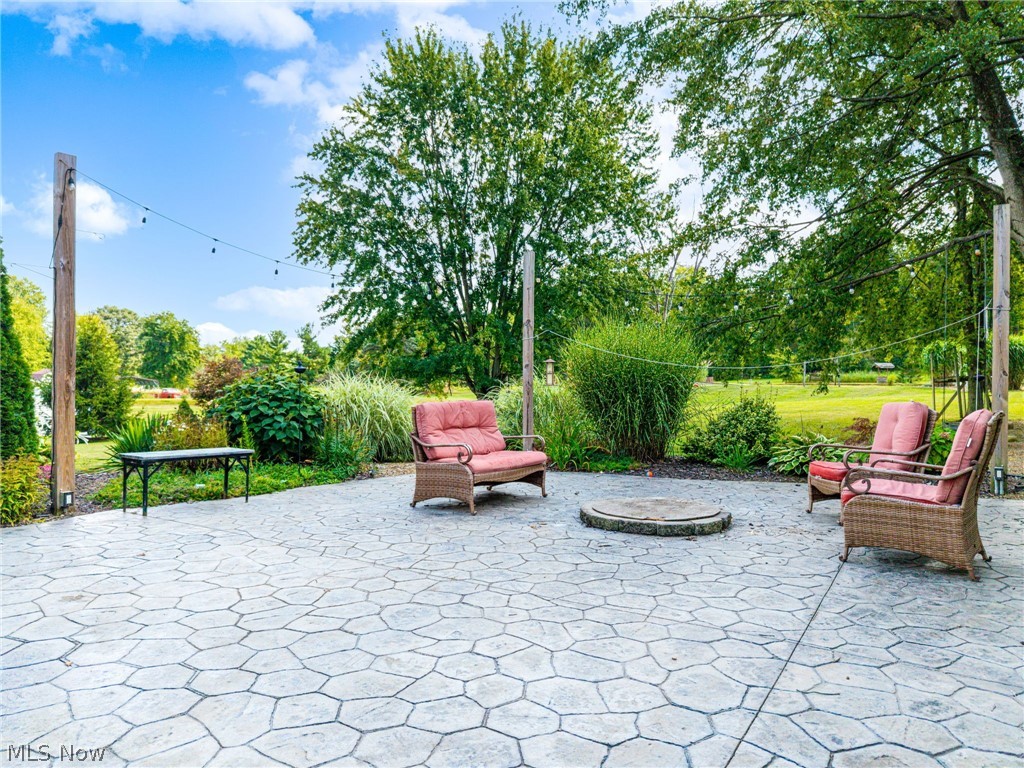 7996 Buffham Road Lodi, OH 44254 - Photo 6 of 40 Spacious stamped concrete patio with a built-in fire pit