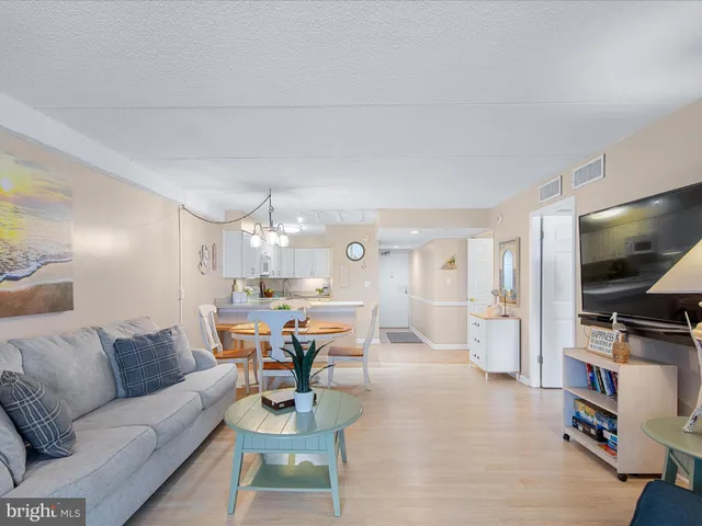 a kitchen with a dining table and chairs