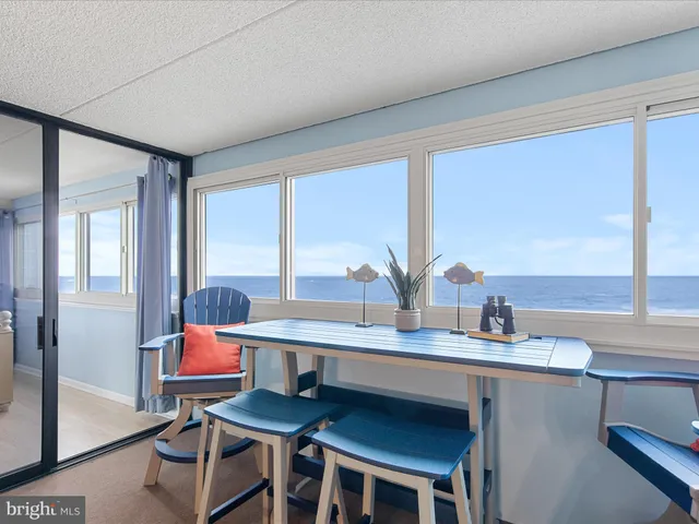 a kitchen with stainless steel appliances granite countertop a sink a stove and cabinets