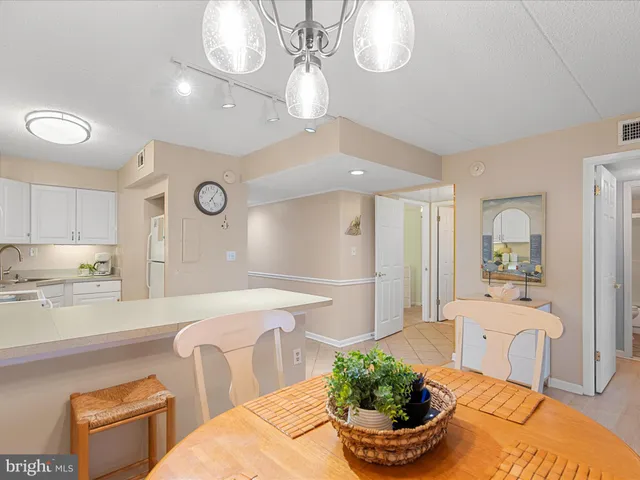 a kitchen with a sink cabinets and appliances