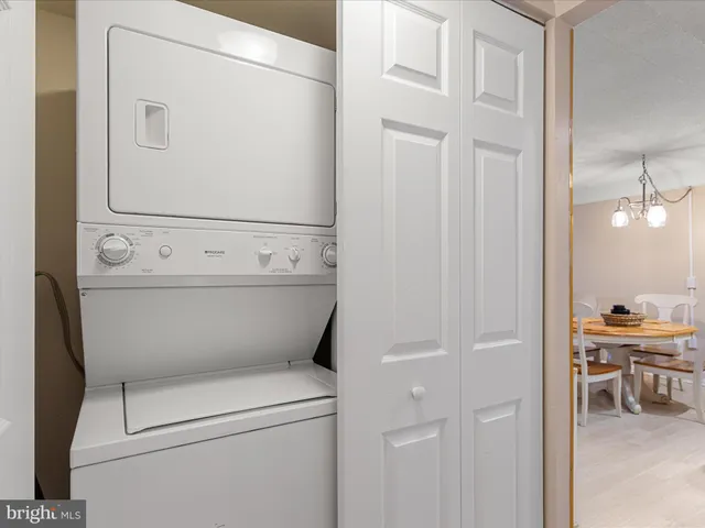 a view of a patio with a table and chairs