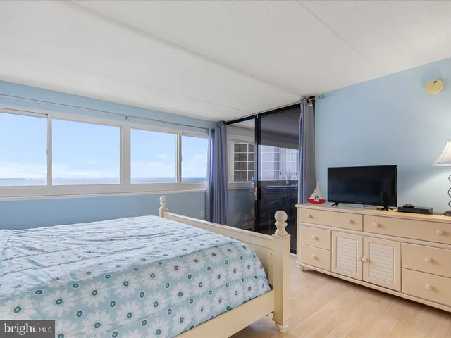 a bedroom with a bed and a television in it