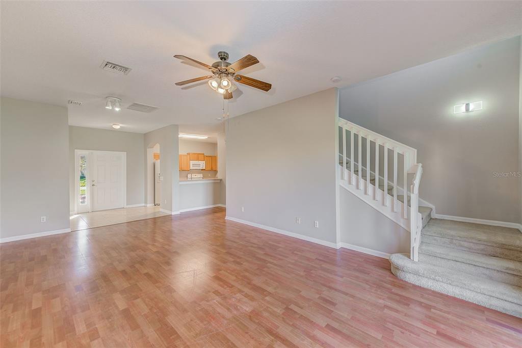 20306 Oak Key Court Tampa, FL 33647 - Photo 12 of 46 a view of an empty room with window and wooden floor