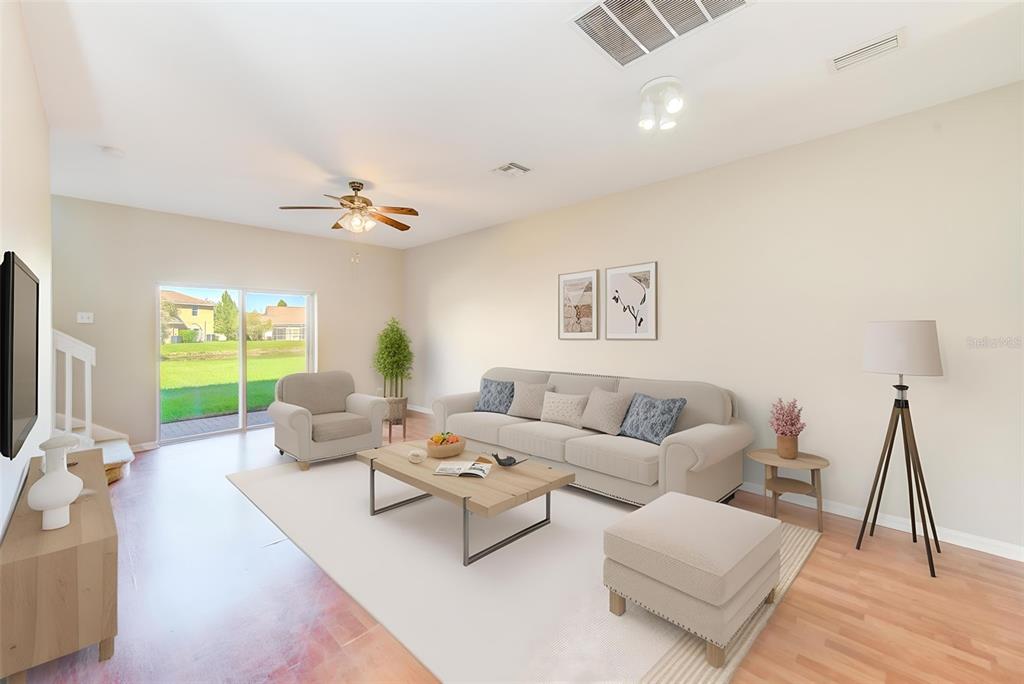 20306 Oak Key Court Tampa, FL 33647 - Photo 14 of 46 a living room with furniture wooden floor and a flat screen tv