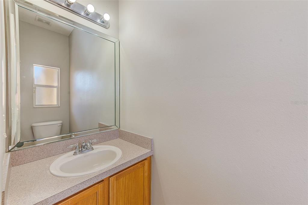 20306 Oak Key Court Tampa, FL 33647 - Photo 15 of 46 a bathroom with a sink and a mirror