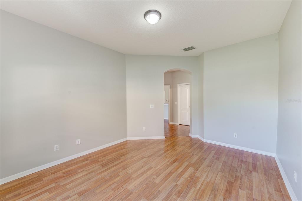 20306 Oak Key Court Tampa, FL 33647 - Photo 26 of 46 a view of an empty room with wooden floor and a window
