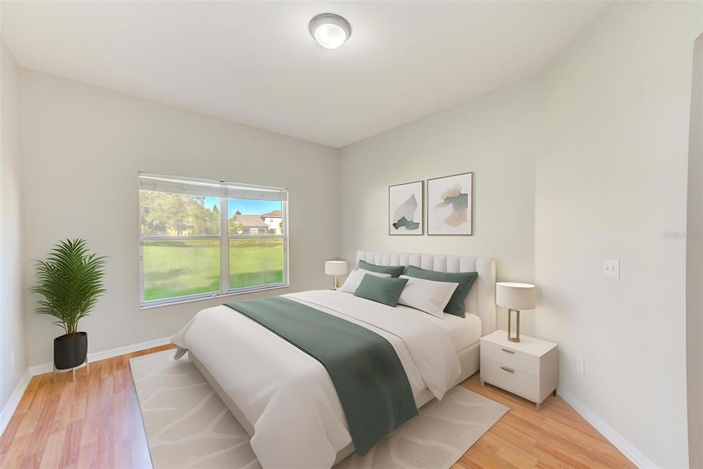 20306 Oak Key Court Tampa, FL 33647 - Photo 27 of 46 a bedroom with a large bed and a large window