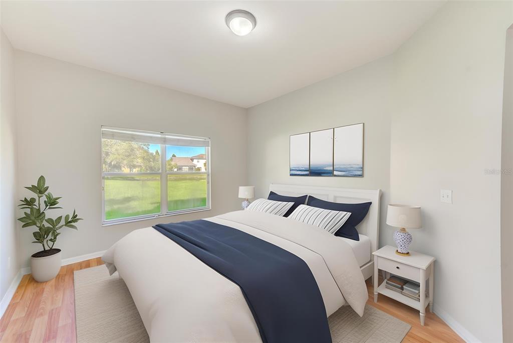 20306 Oak Key Court Tampa, FL 33647 - Photo 28 of 46 a bedroom with a bed and a large window