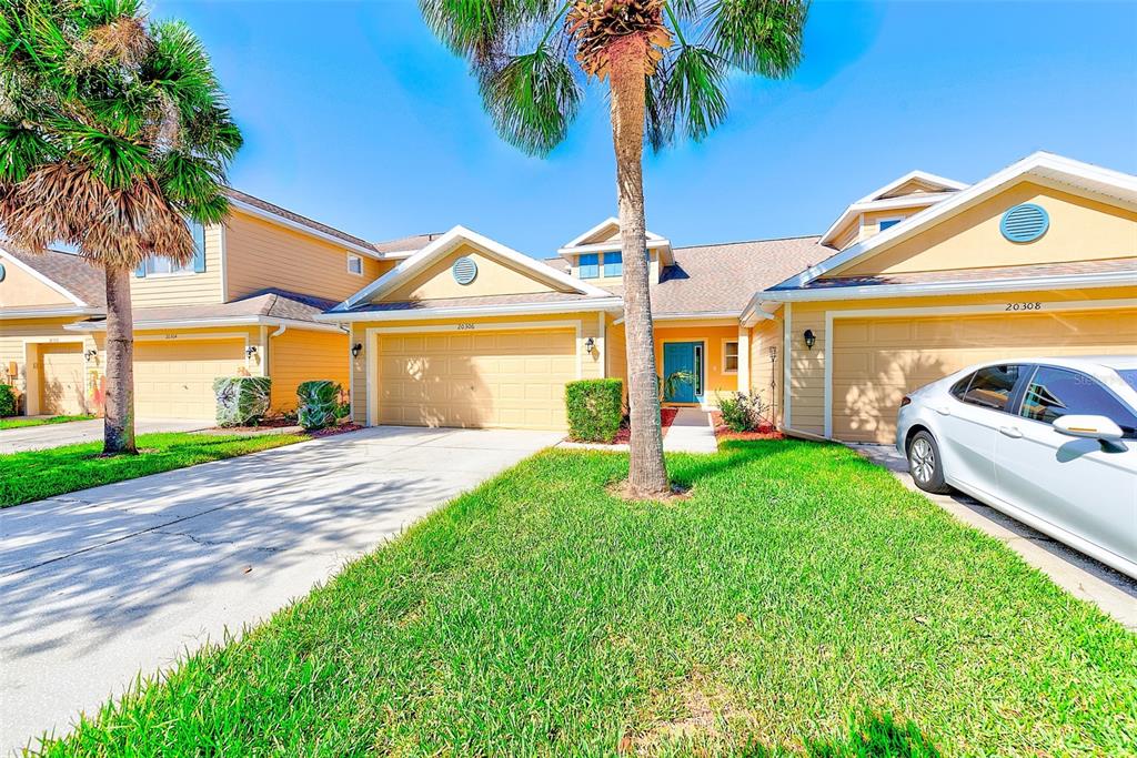 20306 Oak Key Court Tampa, FL 33647 - Photo 3 of 46 a front view of a house with garden