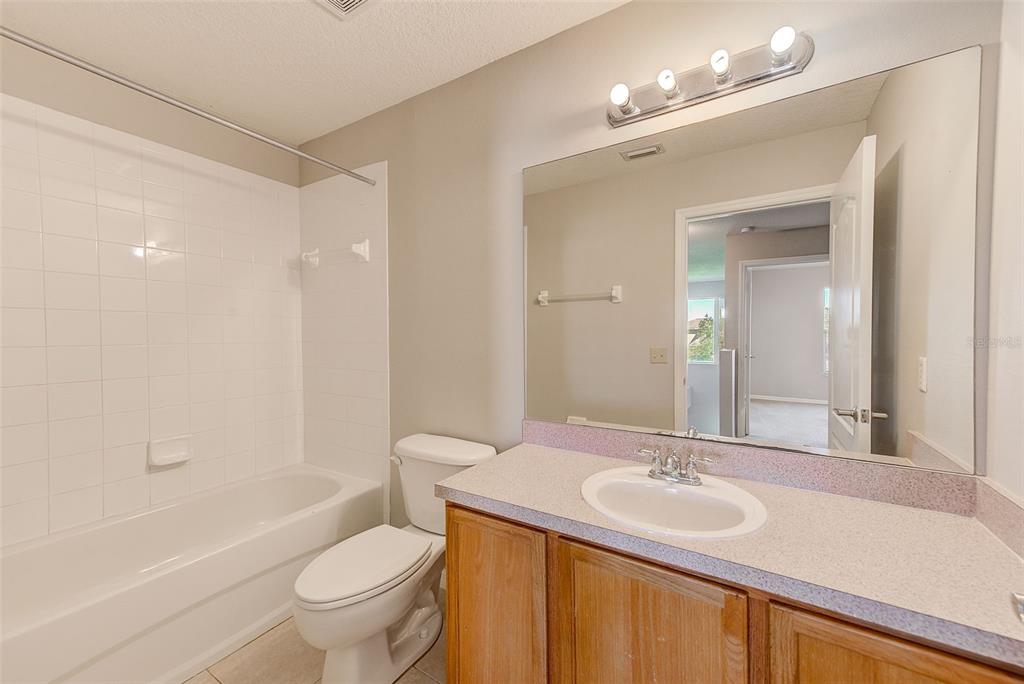 20306 Oak Key Court Tampa, FL 33647 - Photo 32 of 46 a bathroom with a sink toilet tub and shower