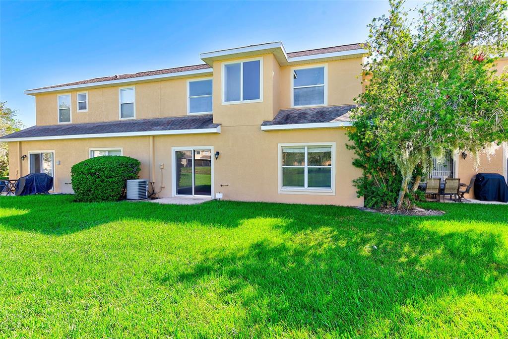 20306 Oak Key Court Tampa, FL 33647 - Photo 38 of 46 front view of a house with a yard