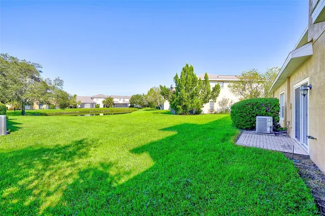 a view of a garden with a building in the background