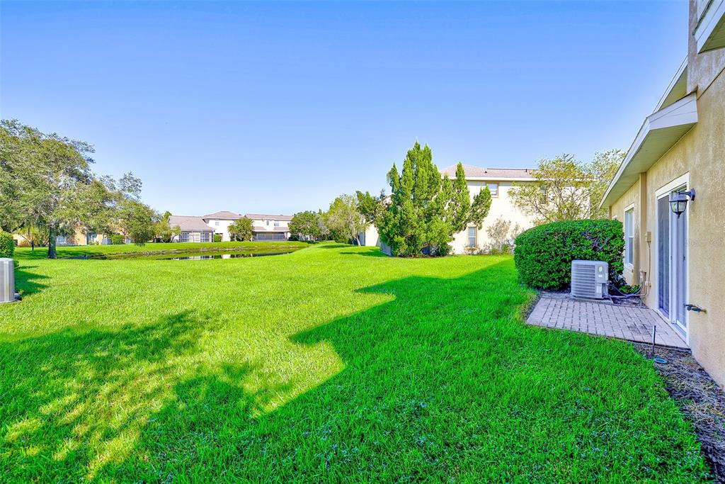 20306 Oak Key Court Tampa, FL 33647 - Photo 40 of 46 a view of a garden with a building in the background
