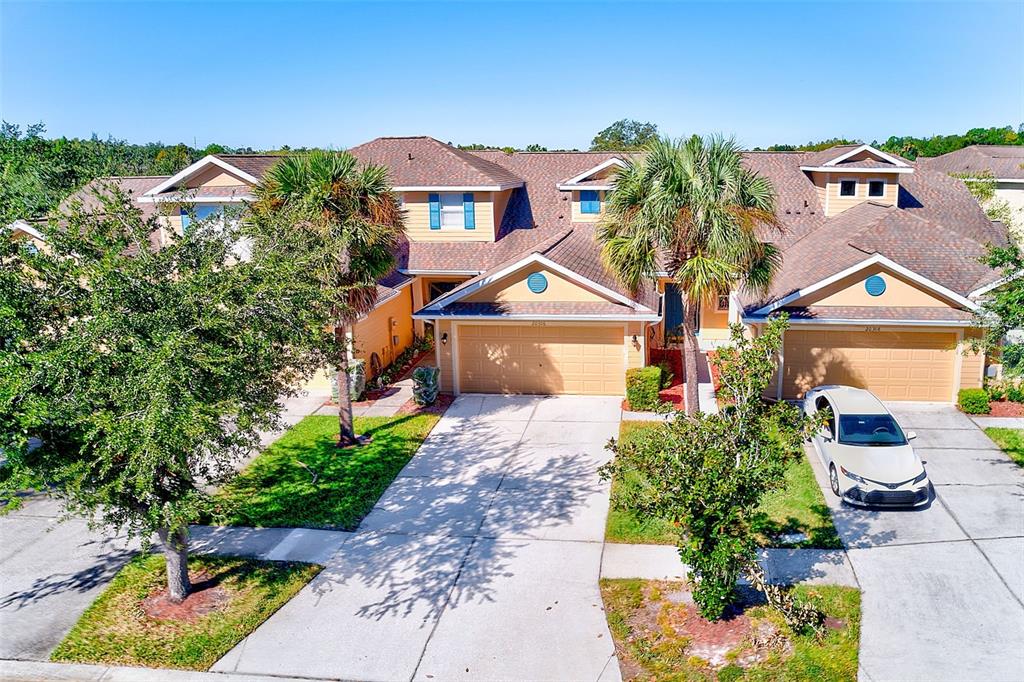 20306 Oak Key Court Tampa, FL 33647 - Photo 5 of 46 a front view of a house with a yard