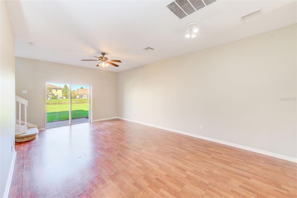 20306 Oak Key Court Tampa, FL 33647 - Photo 10 of 46 wooden floor in an empty room with a window