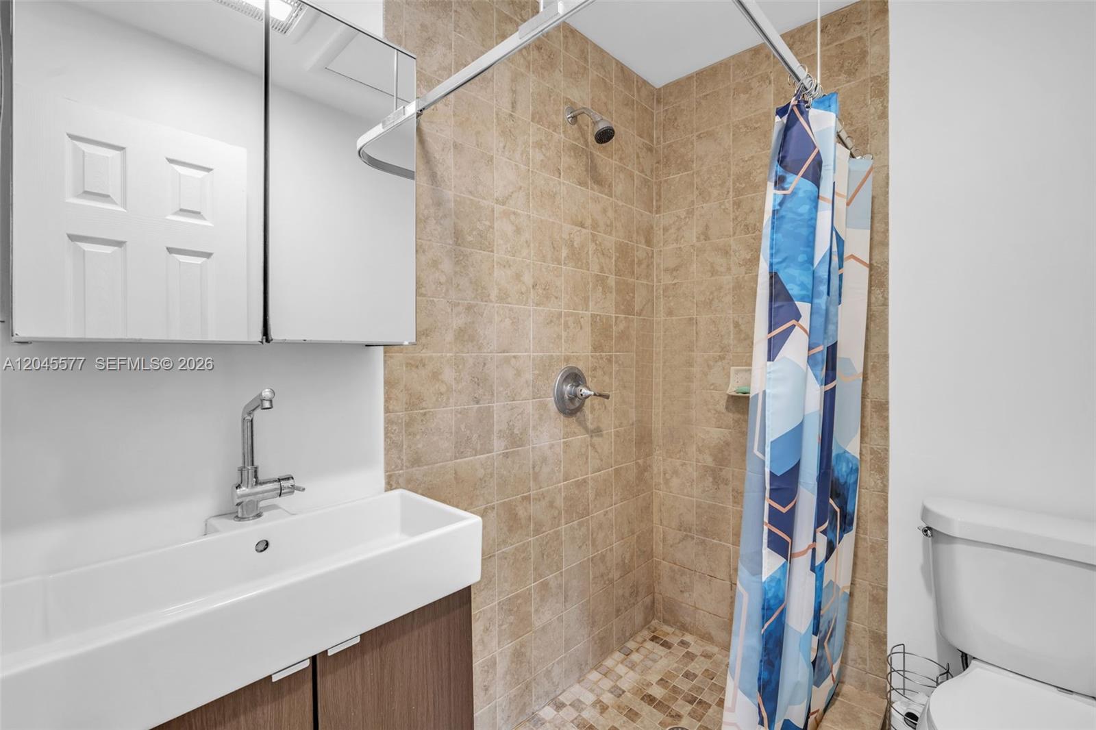 1807 Southwest 102nd Place Miami, FL 33165 - Photo 26 of 52 in-suite bathroom for the bedroom on the opposite side of the other three rooms