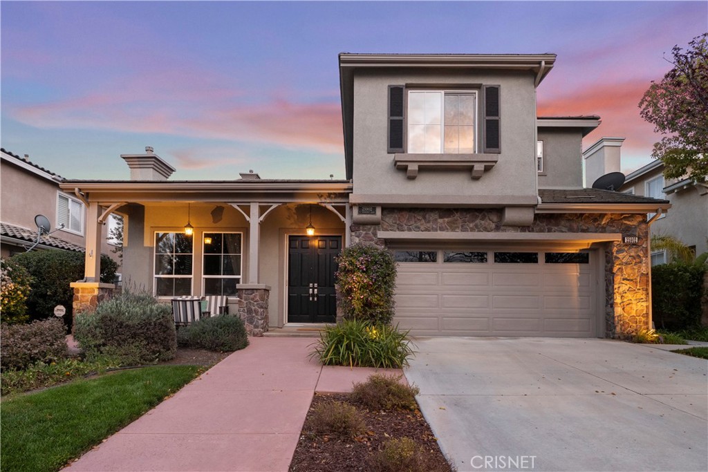 25902 Tennyson Lane Stevenson Ranch, CA 91381 - Photo 1 of 1 a front view of a house with garden