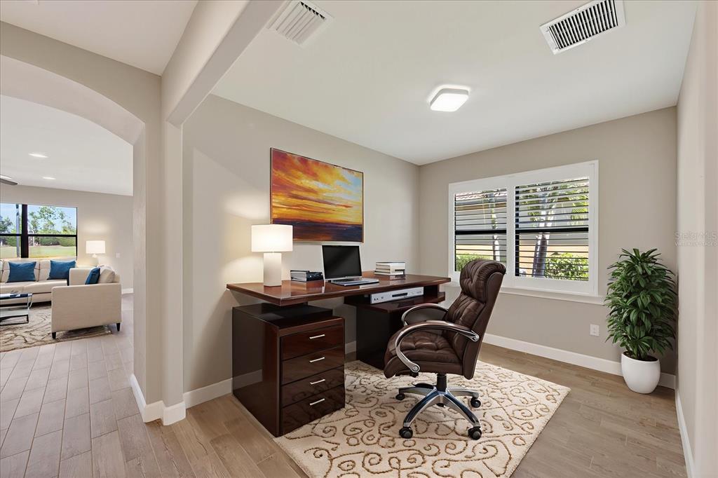 6745 Chester Trail Bradenton, FL 34202 - Photo 22 of 95 a view of a workspace with furniture and a window