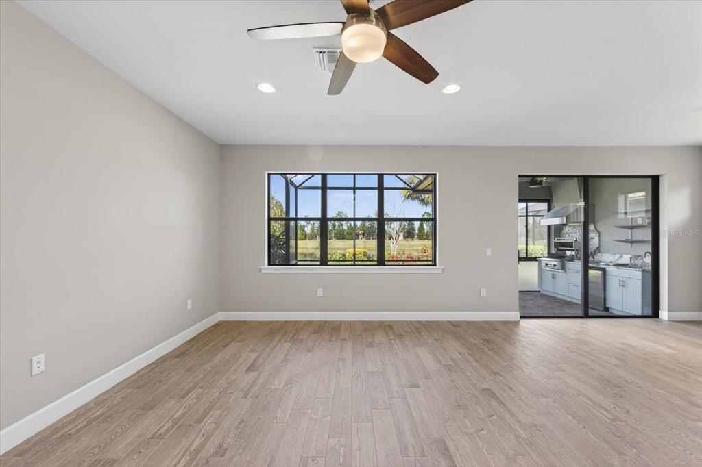 6745 Chester Trail Bradenton, FL 34202 - Photo 24 of 95 wooden floor in an empty room with a window