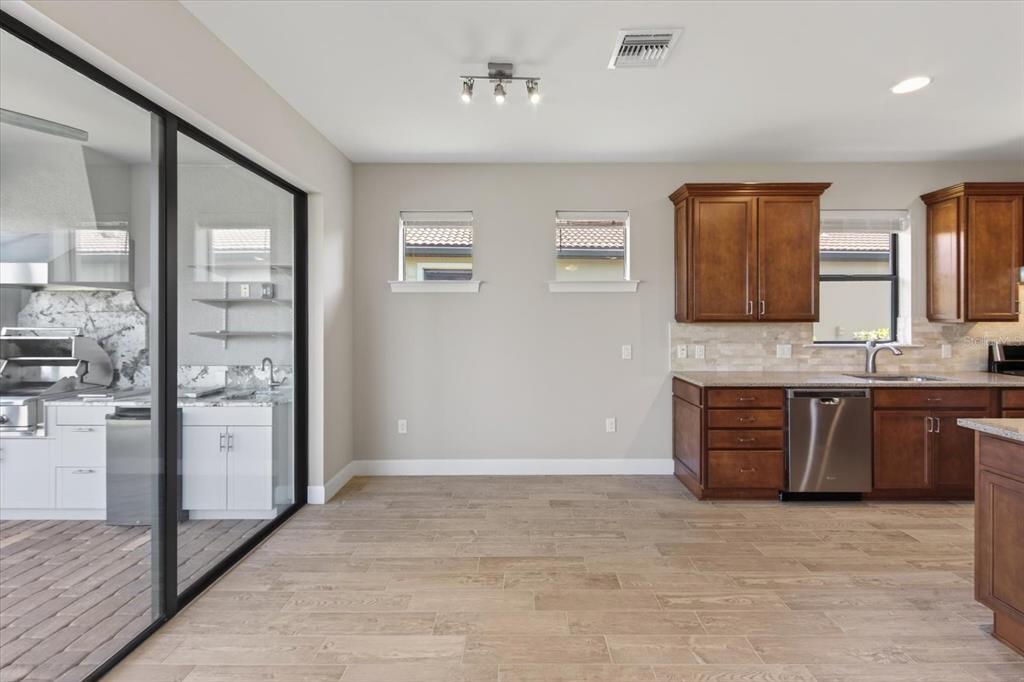 6745 Chester Trail Bradenton, FL 34202 - Photo 32 of 95 a spacious bathroom with a granite countertop sink and a mirror