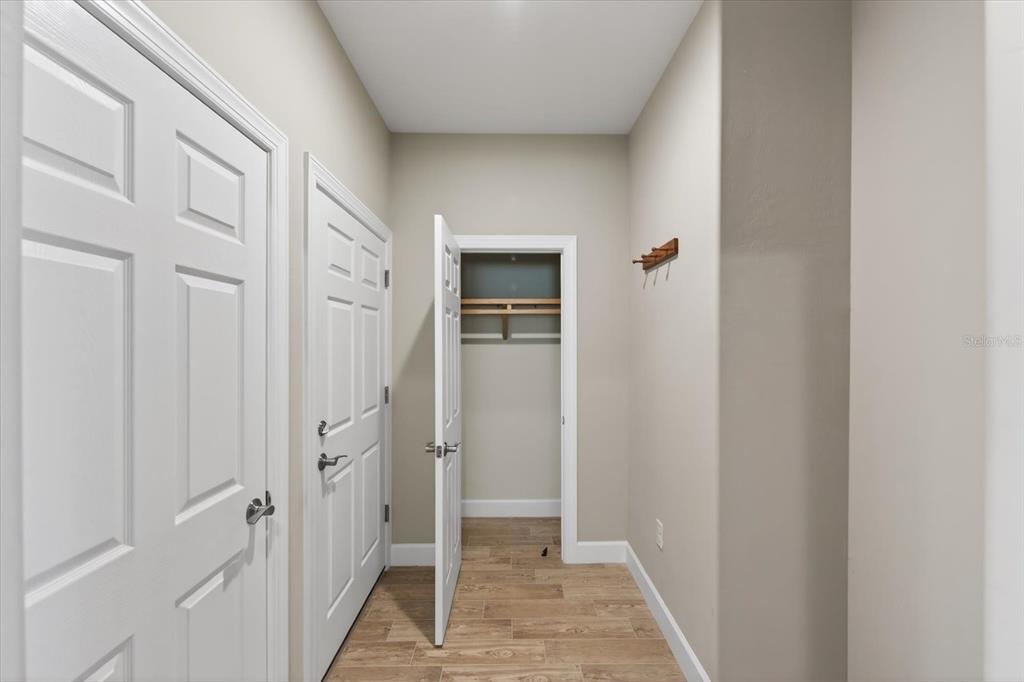 6745 Chester Trail Bradenton, FL 34202 - Photo 37 of 95 a view of a hallway with a wooden door