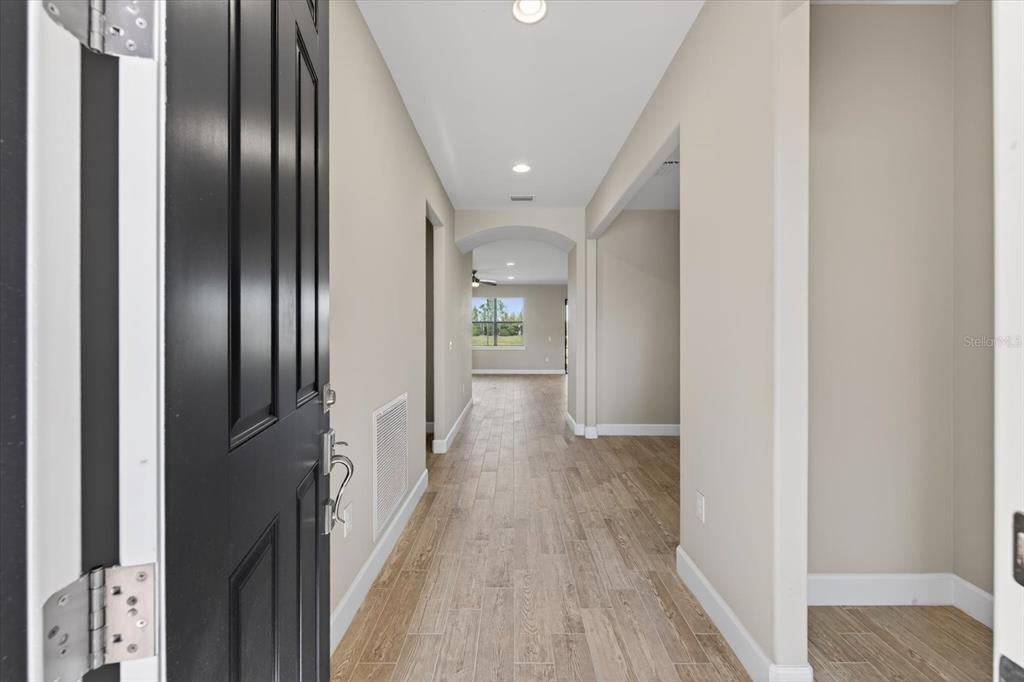 6745 Chester Trail Bradenton, FL 34202 - Photo 5 of 95 a view of hallway with wooden floor