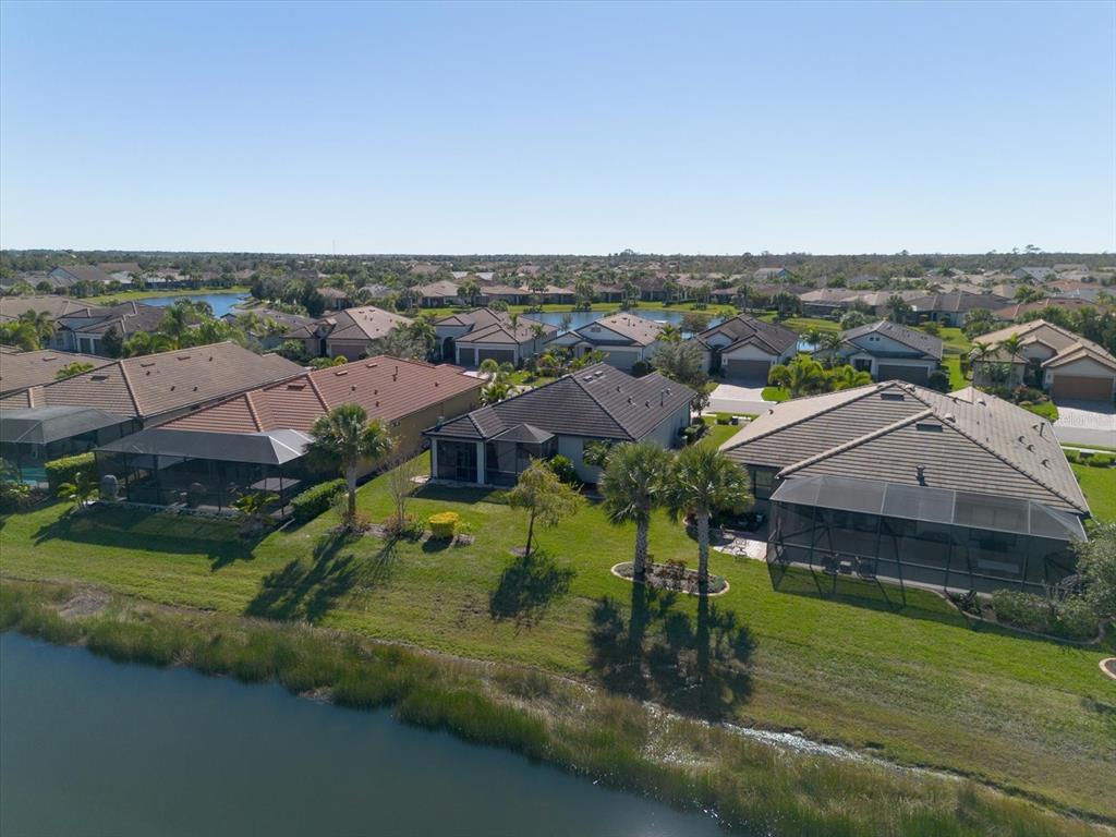 6745 Chester Trail Bradenton, FL 34202 - Photo 57 of 95 an aerial view of a house with a garden