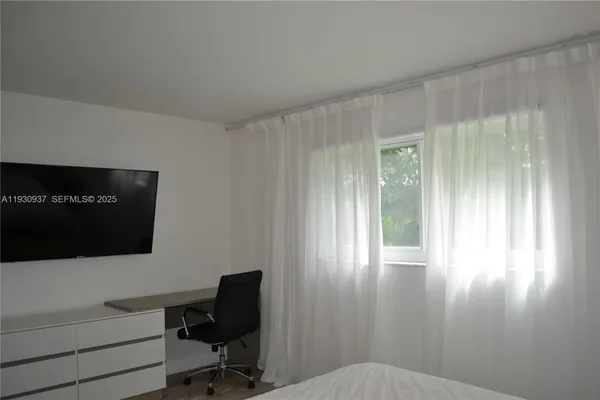 a bathroom with a sink a toilet a mirror and vanity