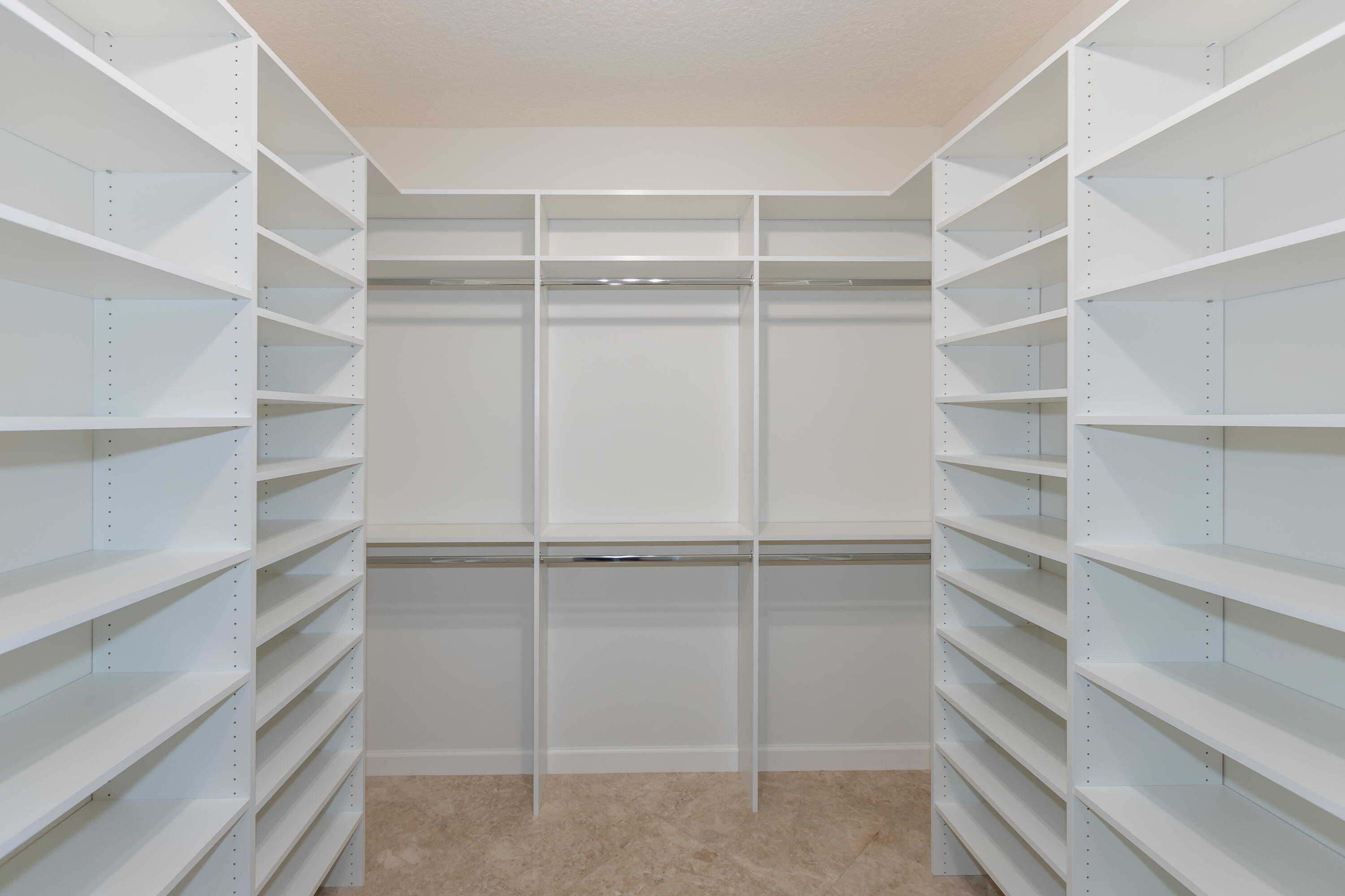 13230 Running Water Road Palm Beach Gardens, FL 33418 - Photo 11 of 32 a view of walk in closet with empty racks