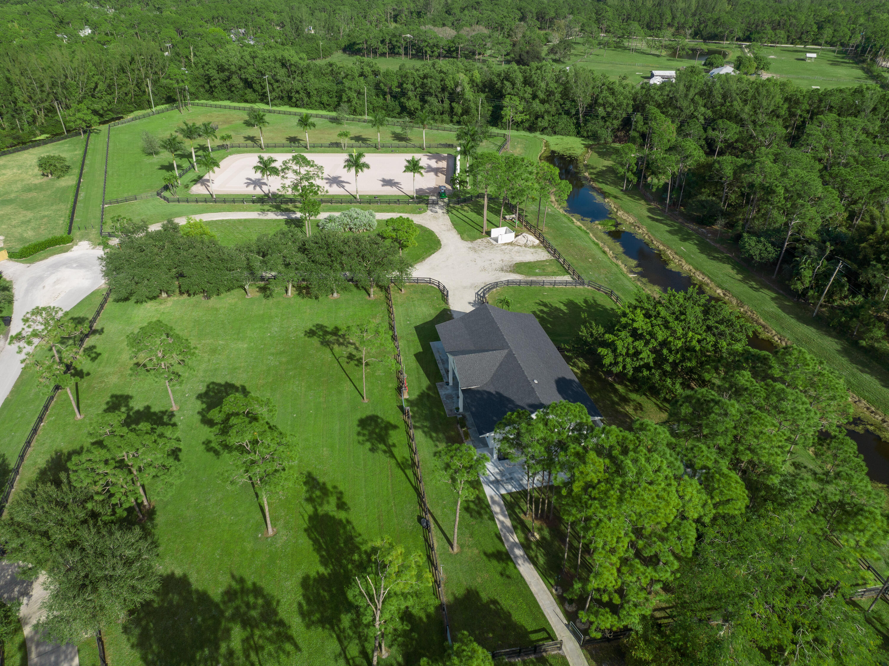 13230 Running Water Road Palm Beach Gardens, FL 33418 - Photo 19 of 32 an aerial view of a house with a yard