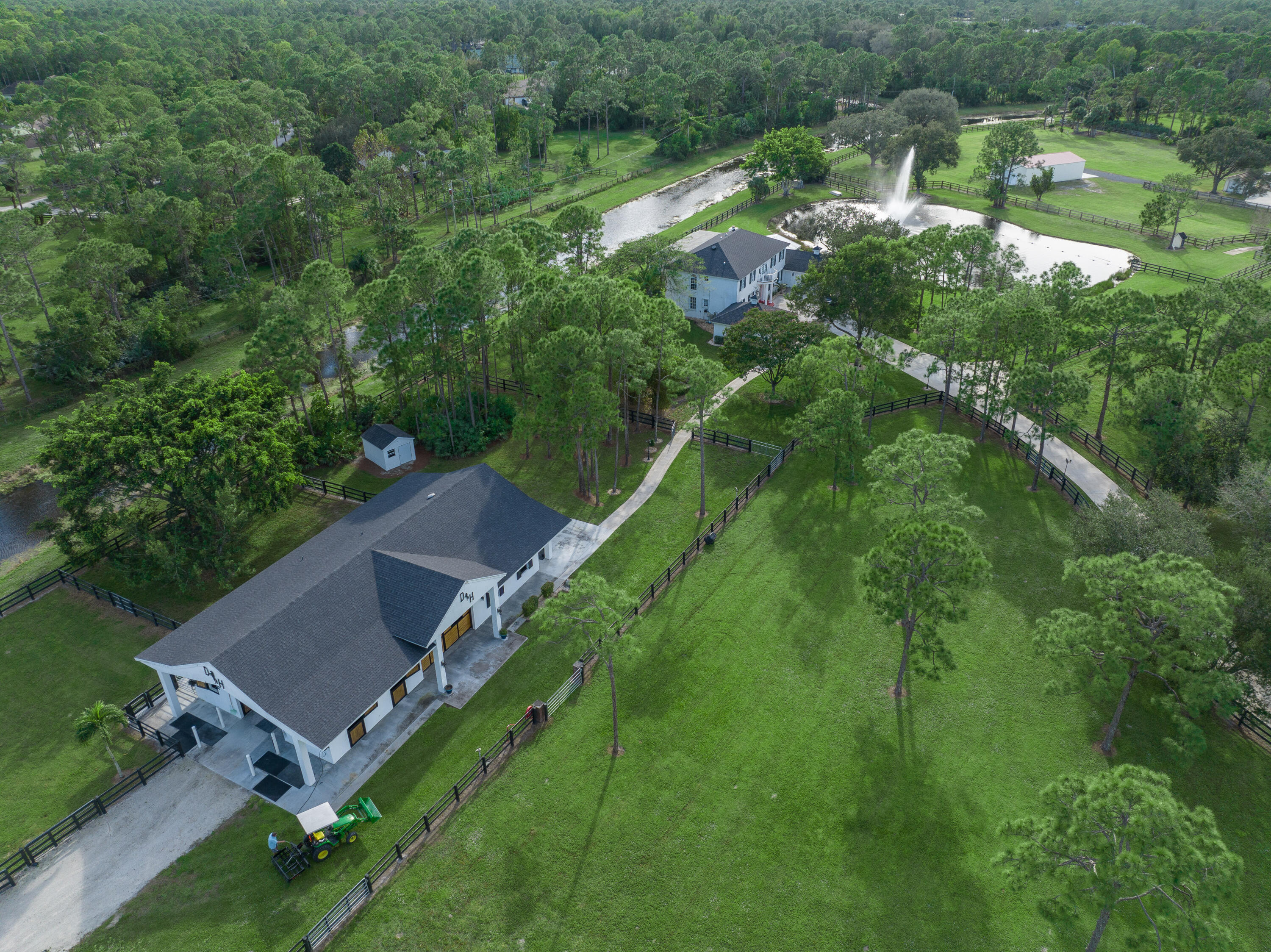 13230 Running Water Road Palm Beach Gardens, FL 33418 - Photo 32 of 32 an aerial view of a house with a yard