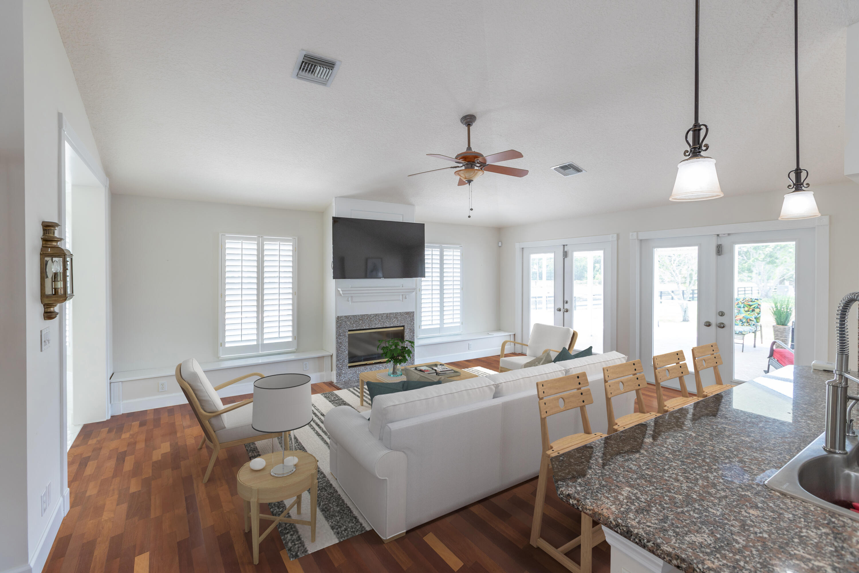 13230 Running Water Road Palm Beach Gardens, FL 33418 - Photo 6 of 32 a living room with furniture a fireplace and a flat screen tv