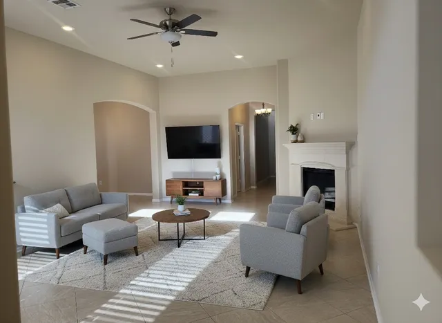 a living room with furniture and a flat screen tv