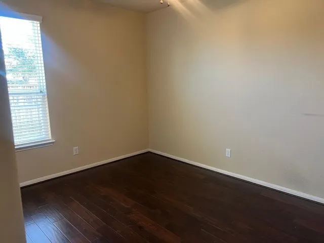 a view of a bathroom with a sink and a mirror