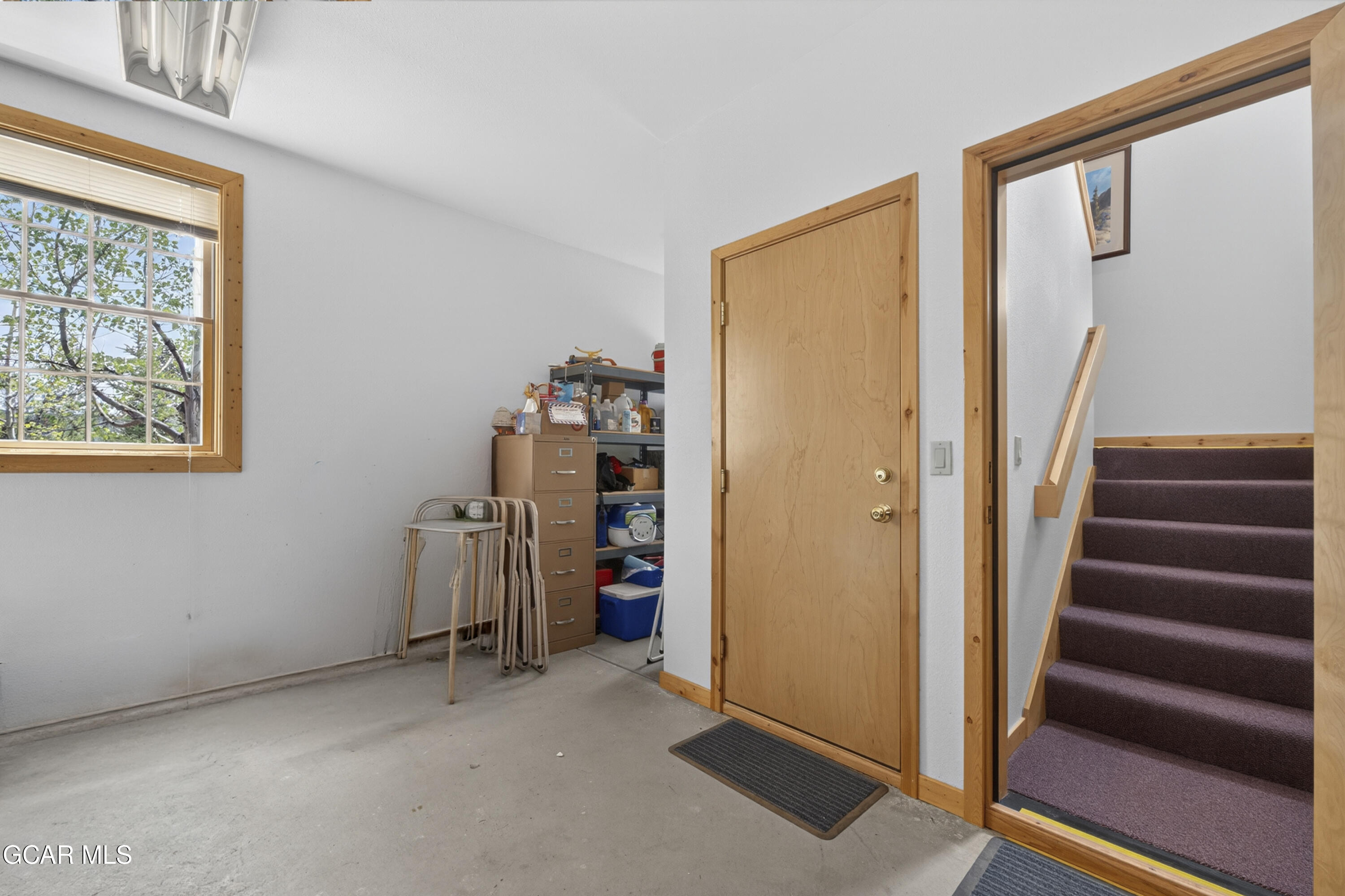 400 Ridge Road Tabernash, CO 80478 - Photo 36 of 50 a view of an empty room with wooden floor and stairs
