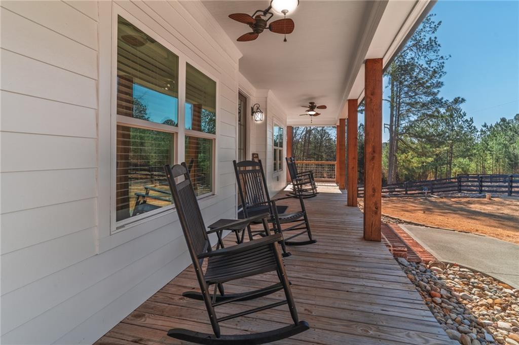 2250 Sperin Road Ball Ground, GA 30107 - Photo 8 of 56 a view of a two chairs and table in the balcony