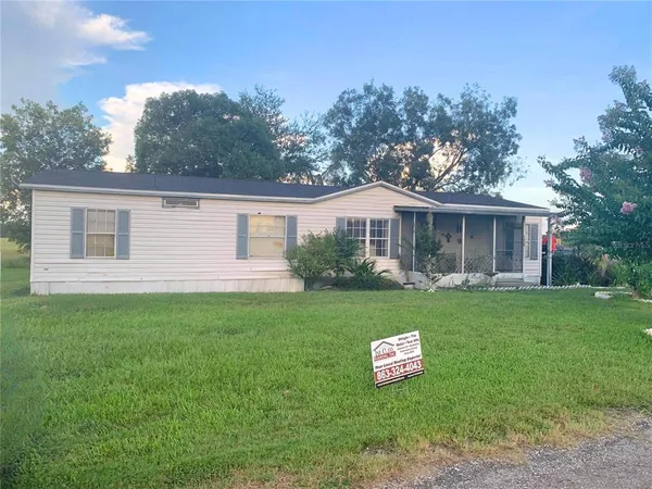 a view of a house with a back yard