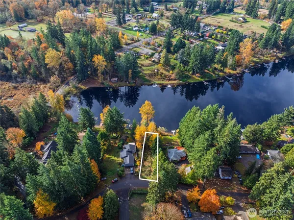 an aerial view of multiple houses with yard